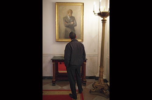 President  Barack Obama contemplating the portrait of John F. Kennedy